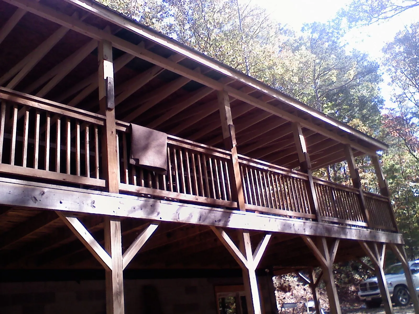 Timber framing under a new elevated porch and deck — Roof Leak Repair in East Branch by Roofing Brothers